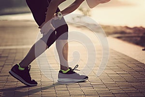 runner with sports running knee injury