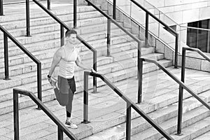 runner in sportswear warming up. Training on fresh air. Athletic young man stretching his legs muscles. sporty man