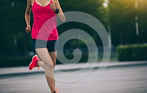 Runner sportswoman jogging and running in urban training workout