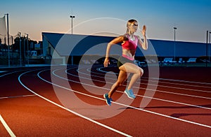 Runner sprinting towards success on run path running athletic track. Goal achievement concept.