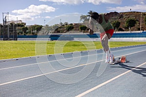 Runner starting a race on an athletics track