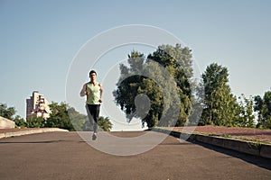 Runner on sunny road. man runner training outdoor. runner athlete workout. confident runner.