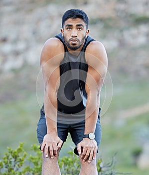 Runner, tired and man with fitness in nature for cardio exercise, challenge and training for marathon. Outdoor