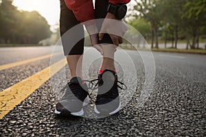 runner touching sport injured calf