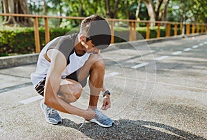 Runner trying running shoes getting ready for run. Healthy lifestyle