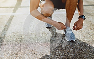 Runner trying running shoes getting ready for run. Healthy lifestyle