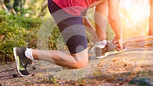 Runner tying his shoe laces