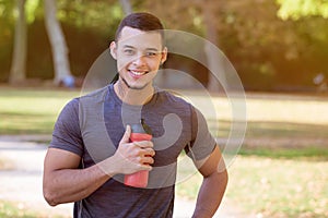 Runner water bottle young latin man running jogging sports training fitness workout copyspace copy space