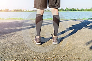 Runner wear the compression sleeve and shoes