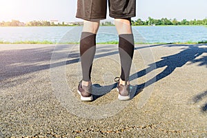 Runner wear the compression sleeve and shoes photo