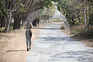 Runner - woman running outdoors training for marathon run.