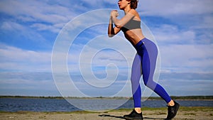 Runner woman stretching legs with lunge hamstring stretch exercise leg stretches. Fitness female athlete relaxing on