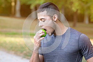 Runner young latin man eating apple running jogging sports training fitness copyspace copy space