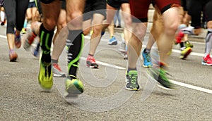 Runners feet on the road in blur motion