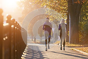 Runners fitness couple jogging in the morning