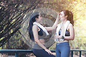 Runners fitness couple running in the city park, Two women exercising by jogging