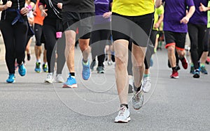 runners at footrace on the road of the city