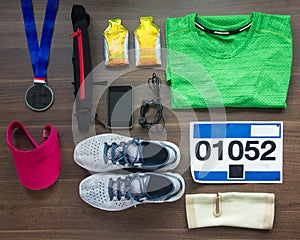 Runners Gear And Energy Gels On Wood Background photo