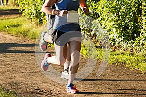 Runners racing a 5K on a dirt path