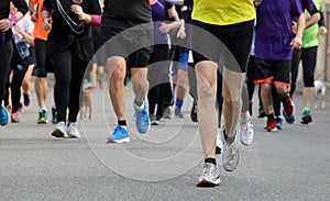 runners run at footrace in the city