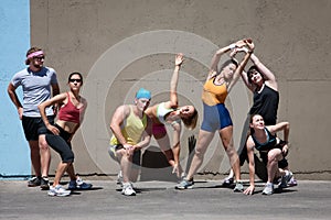 Runners stretching their bodies.