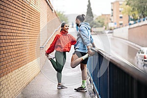 Runners Stretching After Workout