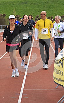 Runners warming up on the track before the race