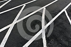 Running asphalt track with white painted lines.