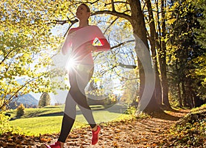 Running through the autumn forest