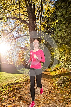 Running through the autumn forest