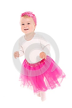 Running baby girl in pink tutu