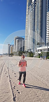 Running on The Beach in Sunny Isle Beach Florida with footprints in the sand