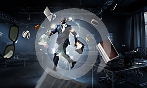 Running black businessman with briefcase