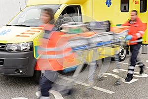 Running blurry paramedics team with stretcher