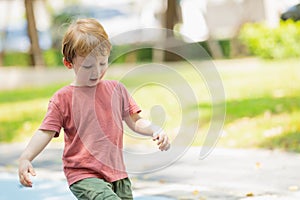 Running boy lovely healthy strong kid active playful outdoor in the park garden summer season