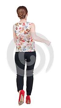 Running business woman. back view. going young girl in suit. Re