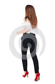 Running business woman. back view. going young girl in suit. Re