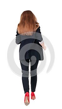 Running business woman. back view. going young girl in suit. Re