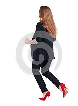 Running business woman. back view. going young girl in suit. Re