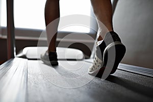 Running those calories off. Closeup shot of a man on a treadmill at the gym.