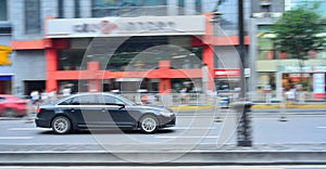 Running car in Chinese city center