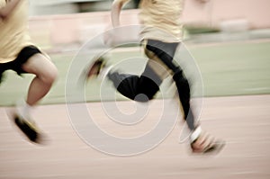 Running child on sport track