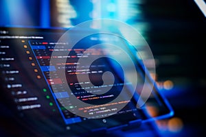 Running Computer data programming. Coding script text on screen. Notebook closeup photo.