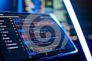 Running Computer data programming. Coding script text on screen. Notebook closeup photo.