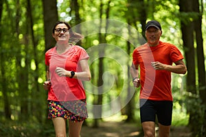 Running couple in the forest