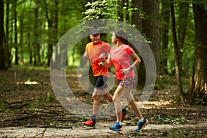 Running couple in the forest