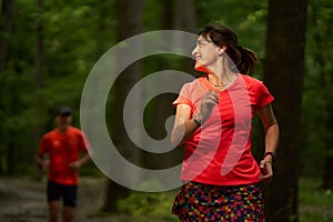 Running couple in the forest