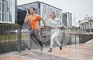 Running, couple and speed run partner in the rain for sport focus and urban workout. City sports, healthy exercise and