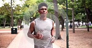 Running, fitness and male runner in nature, cardio and activewear in park for exercise. Workout, health and sports for