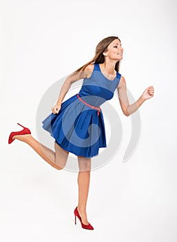 Running girl in blue dress